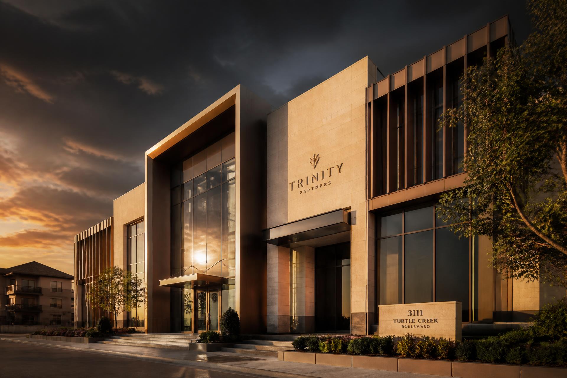 Golden-hour exterior of a modern limestone and bronze commercial building managed by Meridian in Kansas City